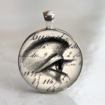 ephemera eye's view sketch drawing vintage necklace or keychain brown